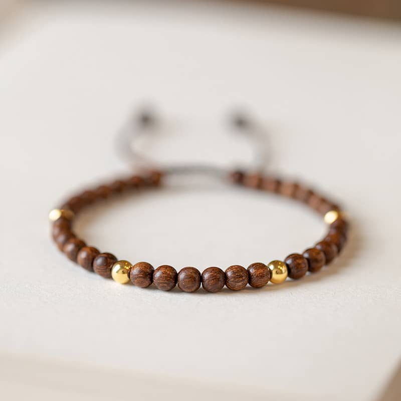 Calming silkwood gold bead bracelet by 5 Senses featuring natural wooden beads and gold accents