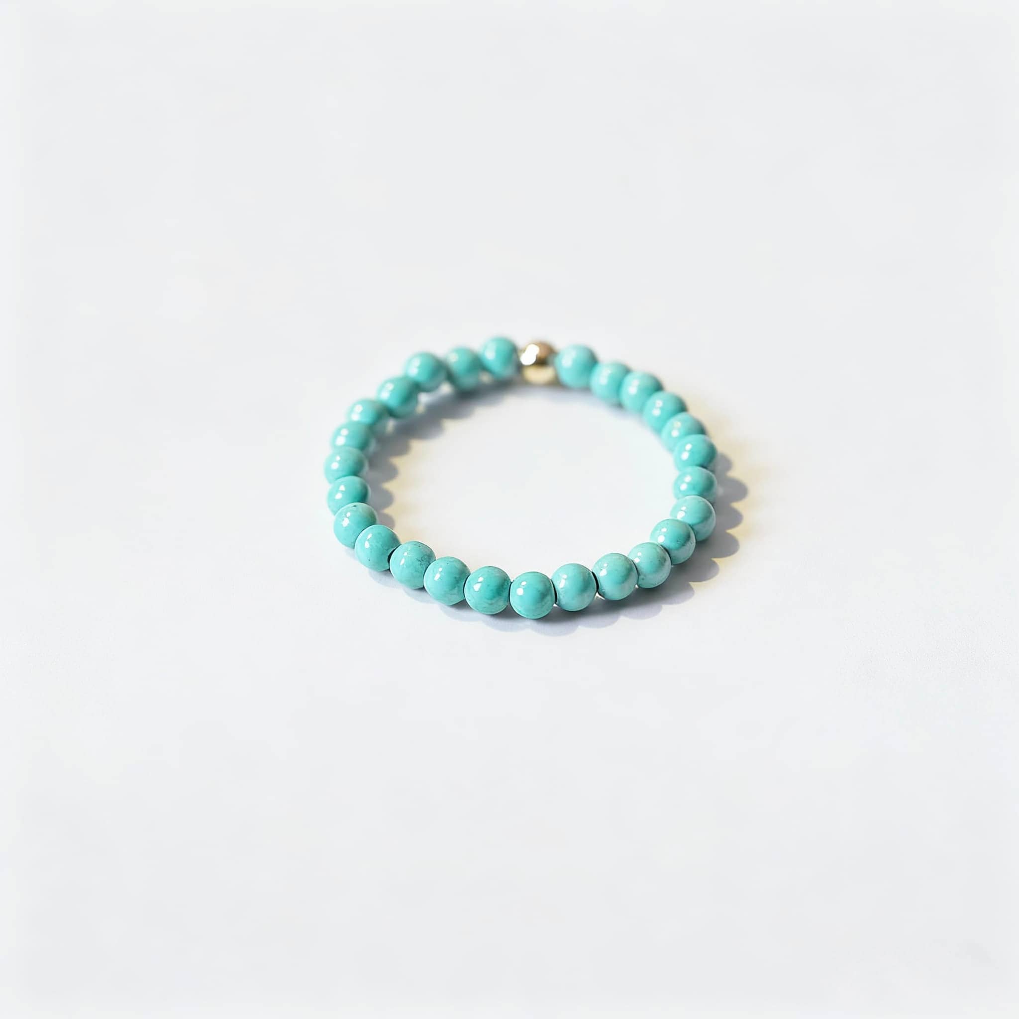 Calming turquoise jewelry for women, featuring a beaded ring by 5 Senses for relaxation and style