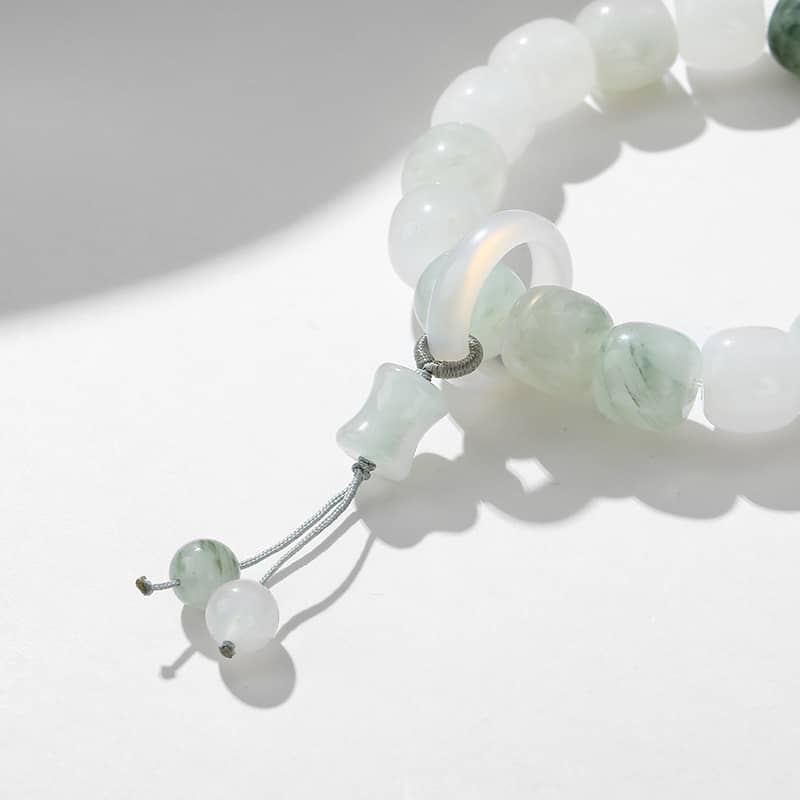 Celestial jade healing bracelet featuring soothing green and white beads for anxiety relief
