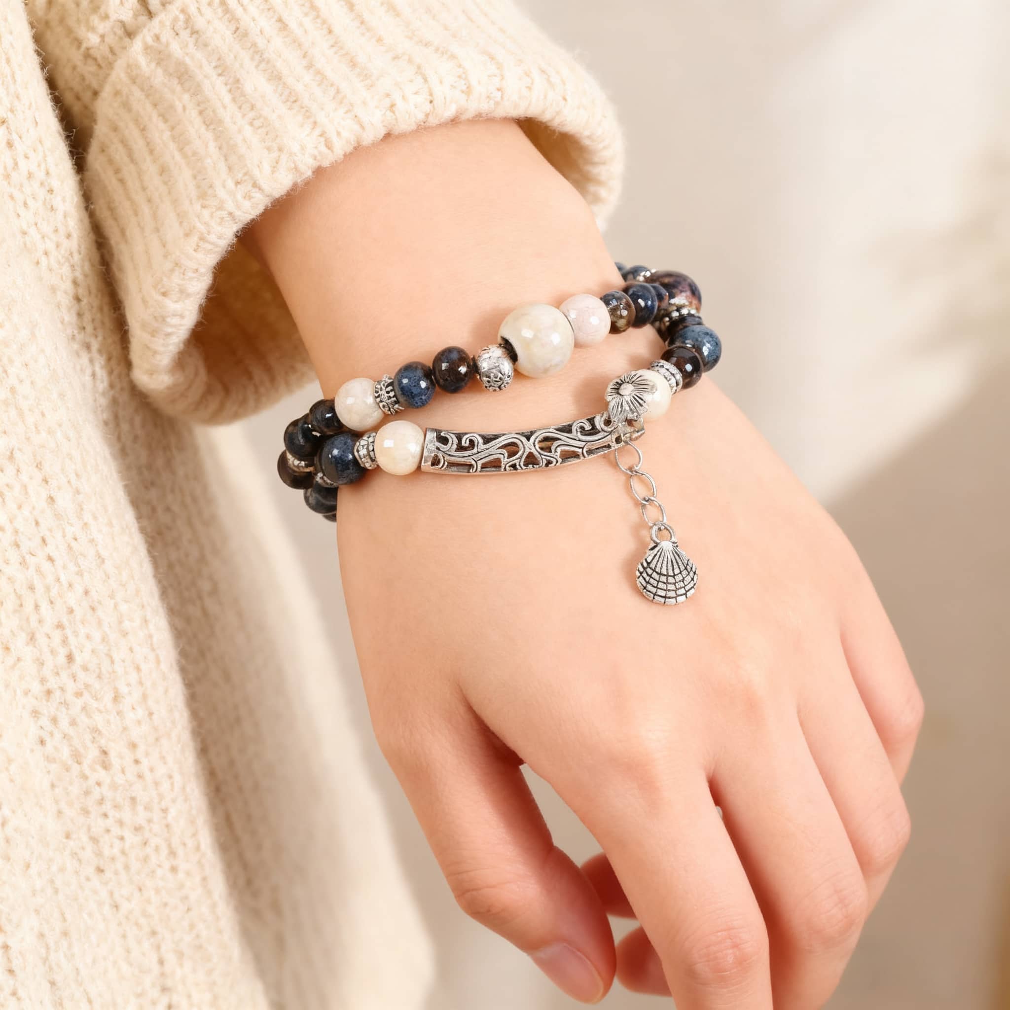 5 Senses ceramic and shell bracelet for self-care featuring a mix of beads and a silver shell charm