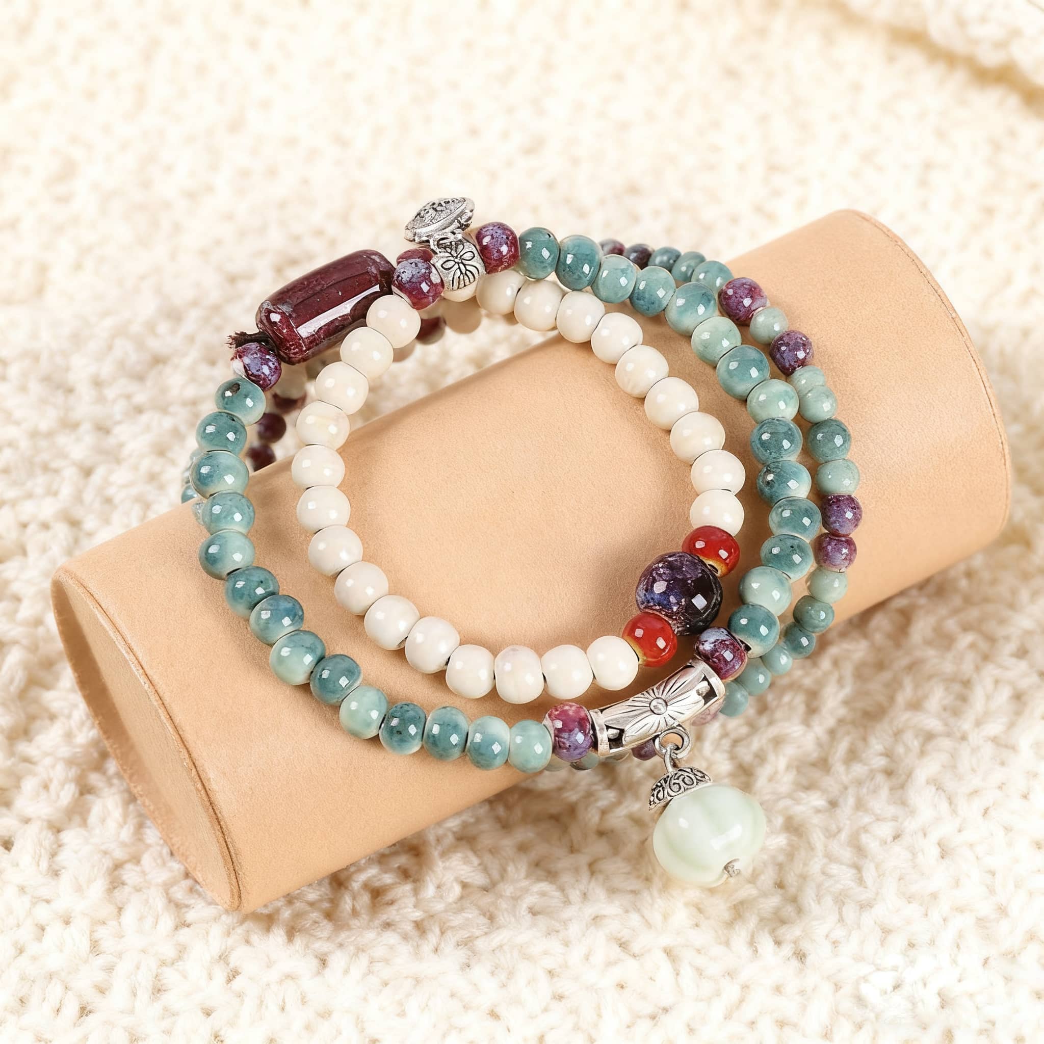 Colorful ceramic bead stacking bracelets featuring varied beads on a soft background
