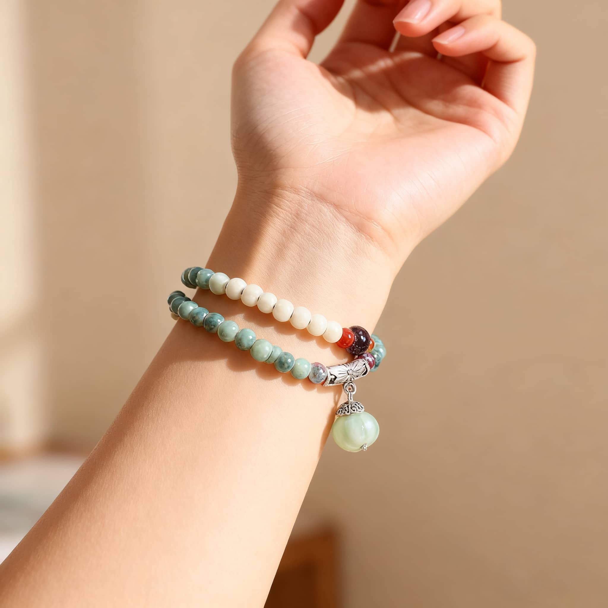 Elegant ceramic bead stacking bracelets featuring white and black beads, perfect for layering.