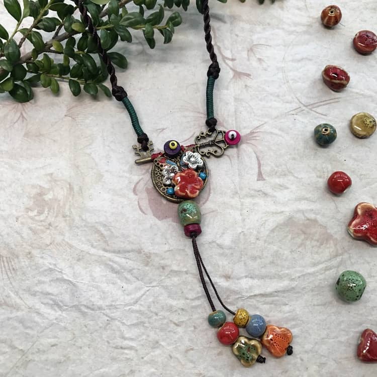 Colorful ceramic key necklace for self-care featuring unique beads and intricate designs