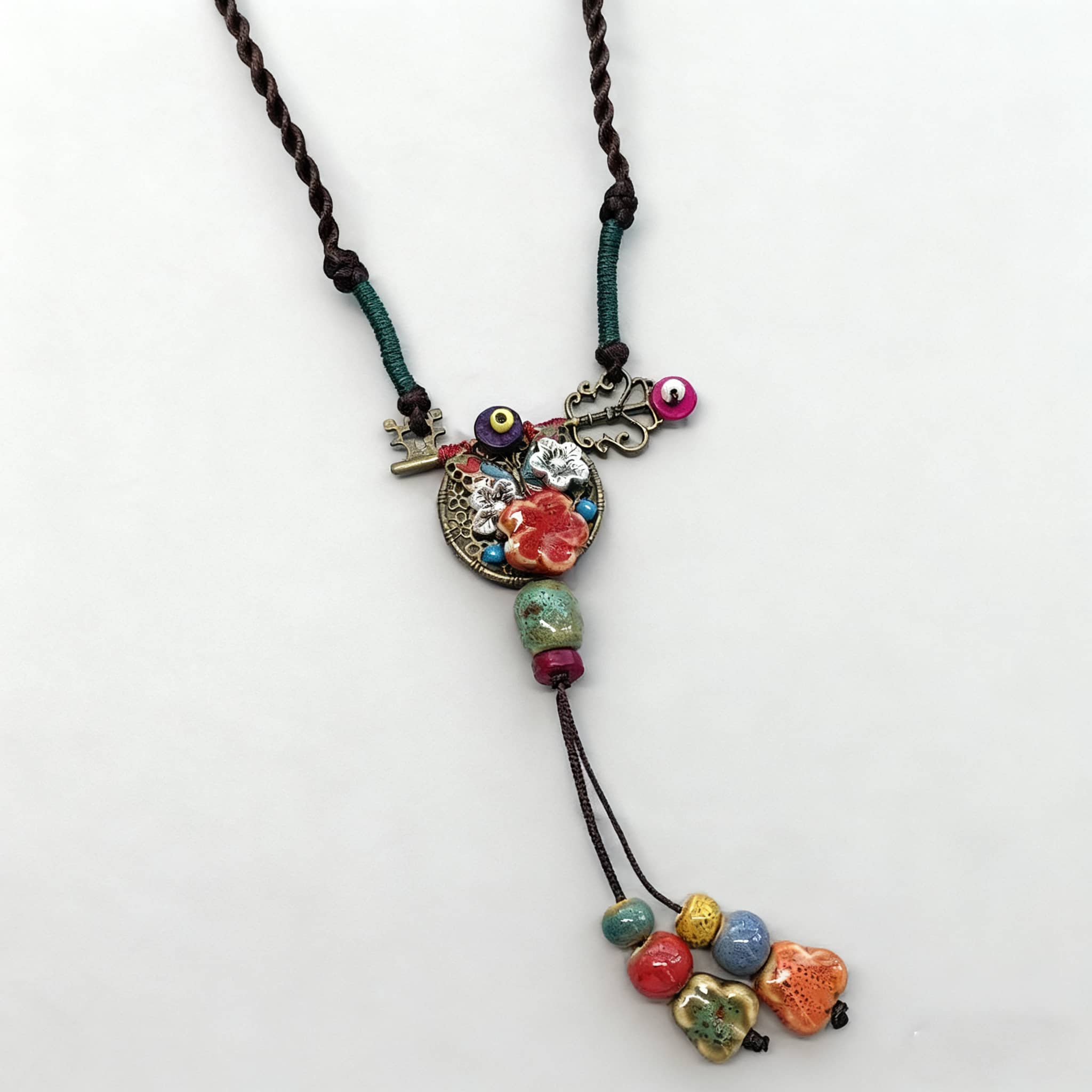 Colorful ceramic key necklace for self-care with braided cord and vibrant beads