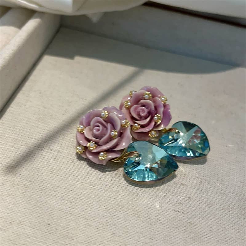 Ceramic rose zircon earrings featuring purple rose designs and blue heart-shaped stones