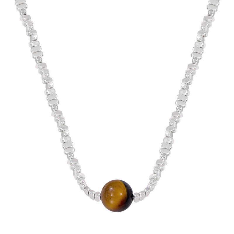 Anxious healing crystal necklace silver chain featuring a polished brown and black stone bead