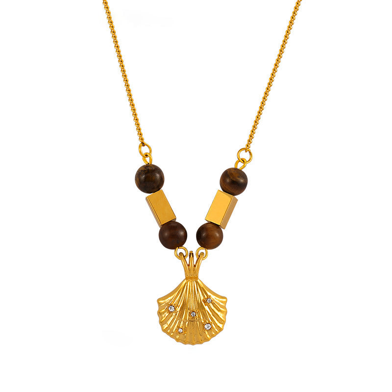 Insecure necklace with gold shell pendant and tiger's eye beads featuring tiger's eye jewelry for confidence