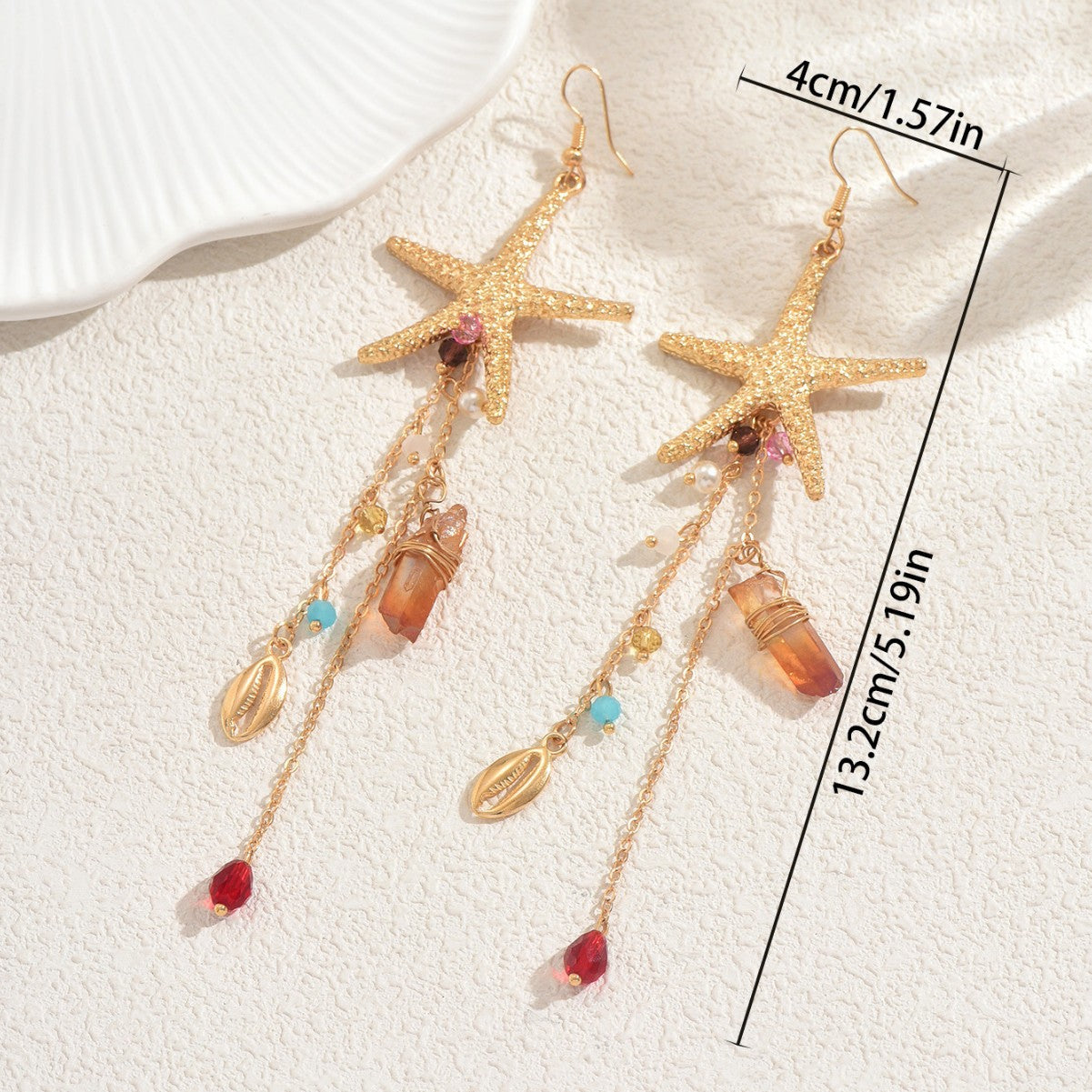 Gold starfish drop earrings with dangling shells turquoise and red beads and crystal accents ocean inspired statement jewelry