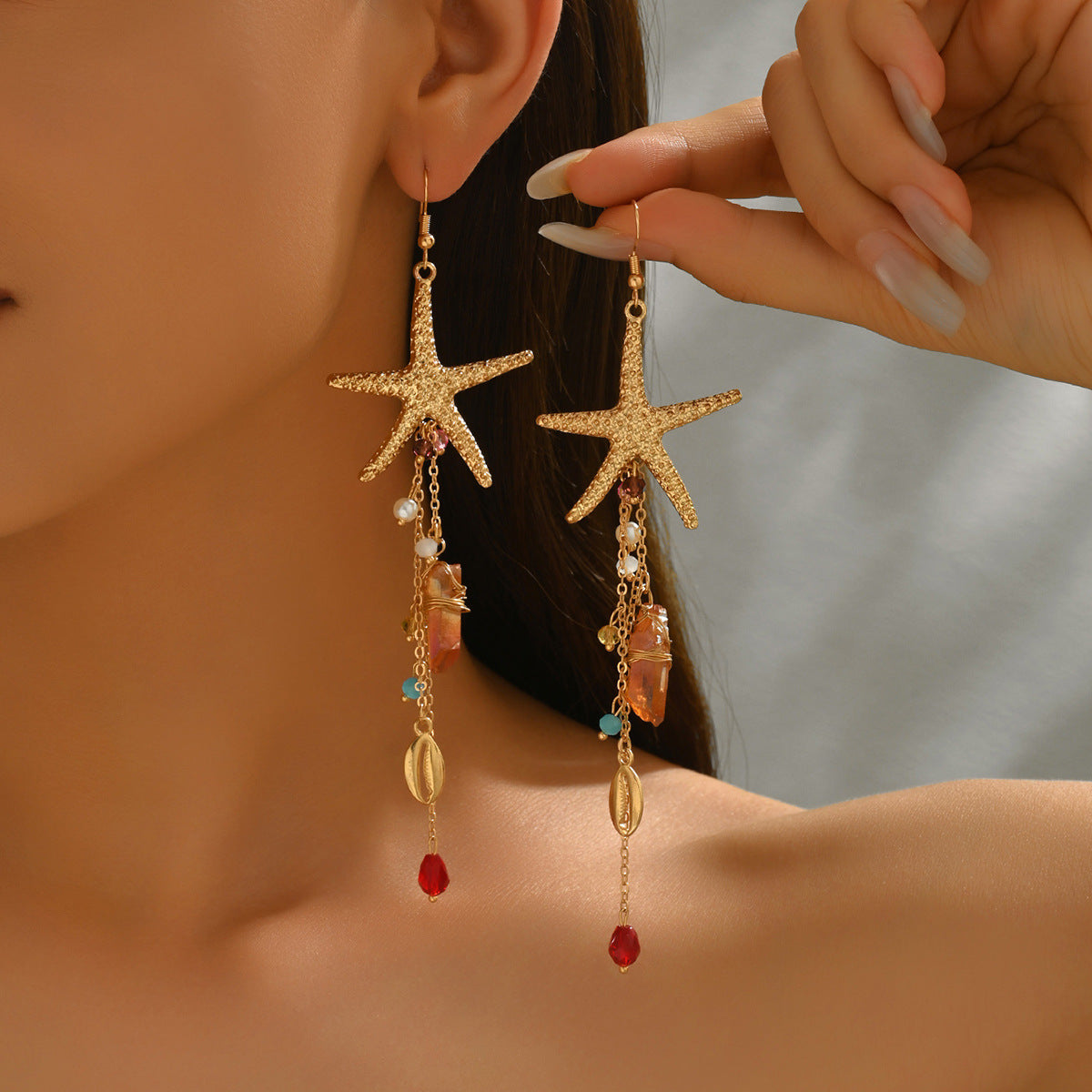 Gold starfish dangle earrings with shells pearls turquoise beads and red drops ocean inspired statement jewelry