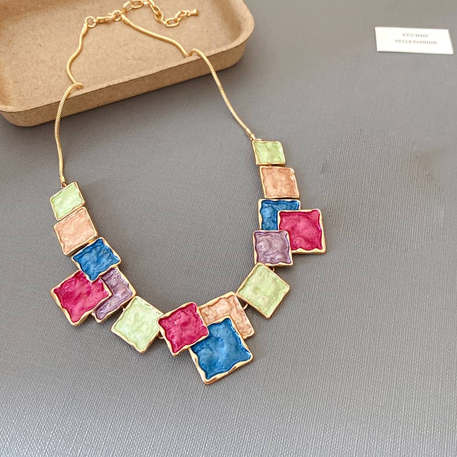 Color blocked asymmetrical necklace by 5 Senses featuring vibrant square-shaped pendants