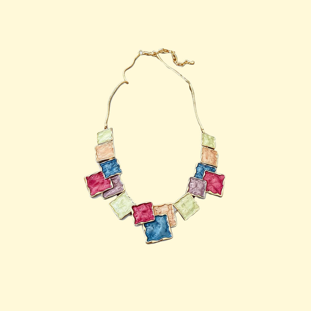 Color blocked asymmetrical necklace by 5 Senses with vibrant textured square pendants