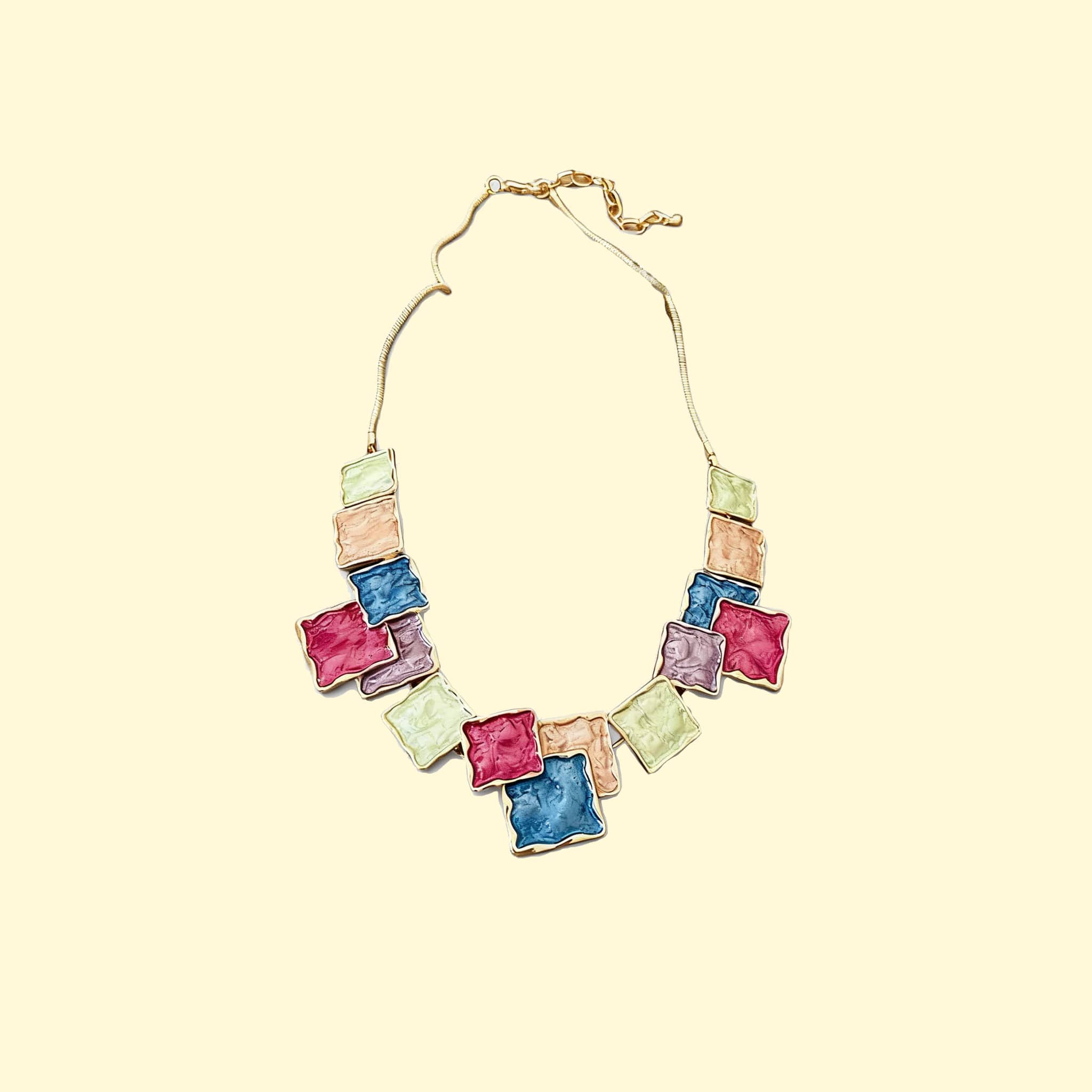 Color blocked asymmetrical necklace by 5 Senses with vibrant textured square pendants