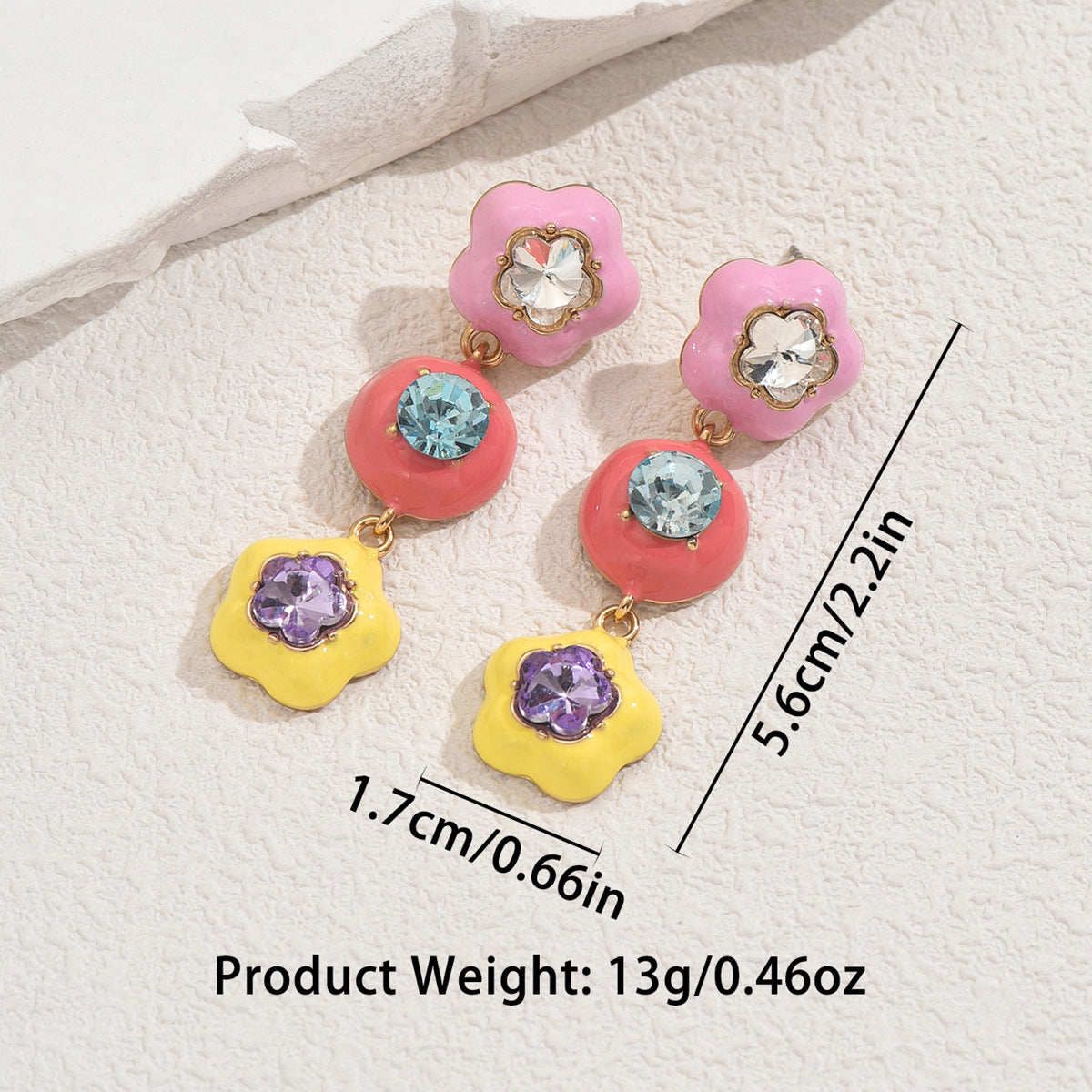 star shaped colorful earrings for women with floral drop elements in pink red and yellow enamel with crystal centers