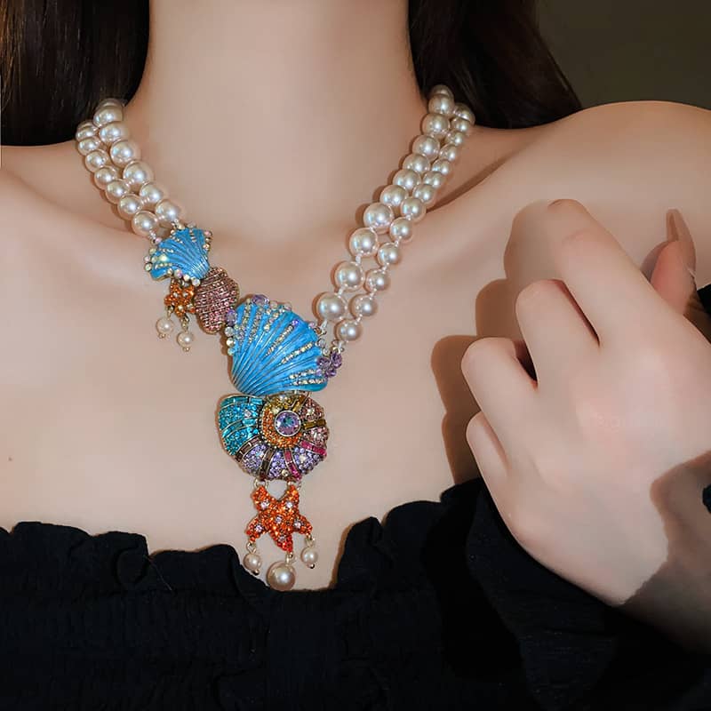 Stunning conch and pearl necklace featuring colorful seashells and decorative pearls