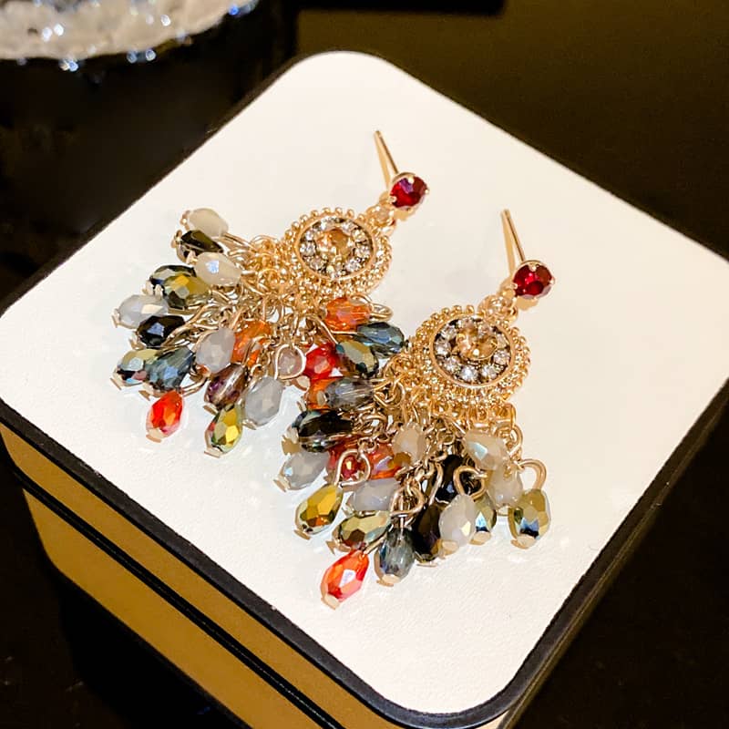 Elegant crystal fringe drop earrings with colorful beads and gold accents for a stunning look