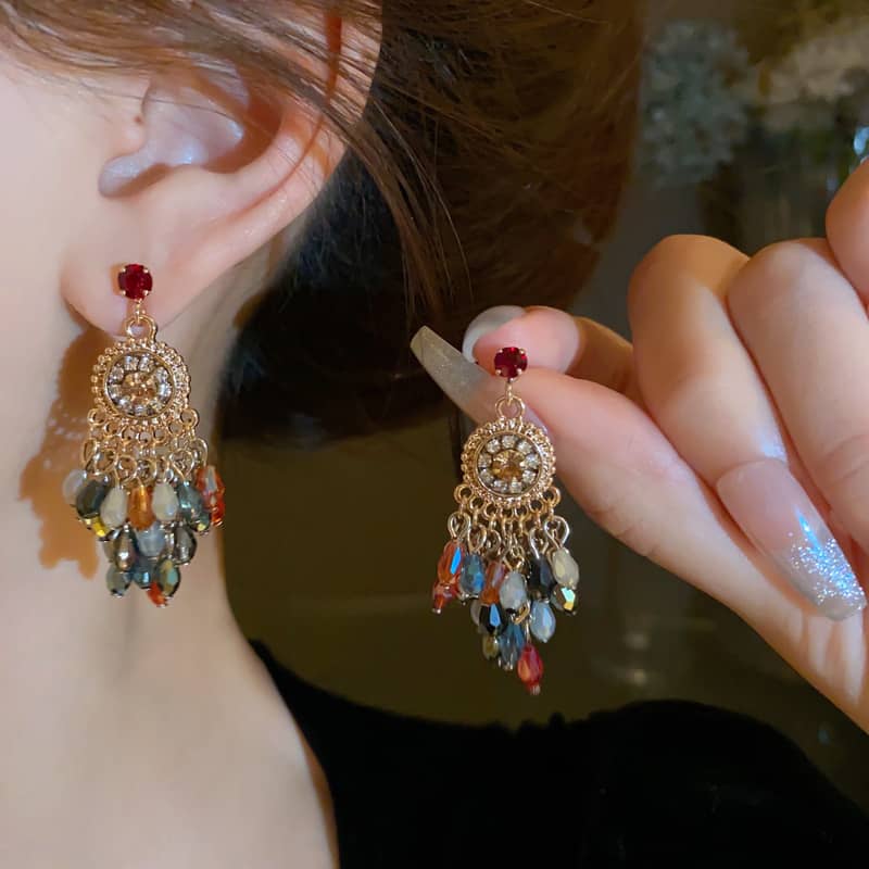 Elegant crystal fringe drop earrings with colorful beads and gold accents for a stylish look