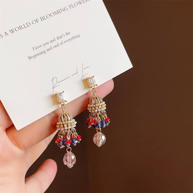 Colorful crystal wind chime earrings with intricate bead design and gold accents from 5 Senses
