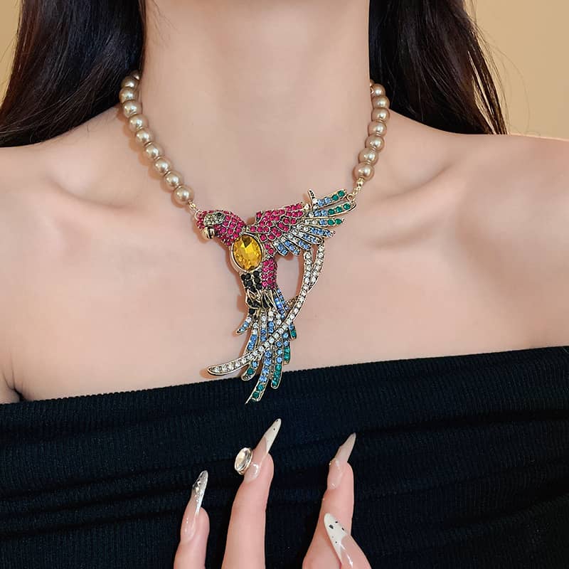 Joy Necklace with diamond accent bird jewelry featuring colorful gems and pearl chain