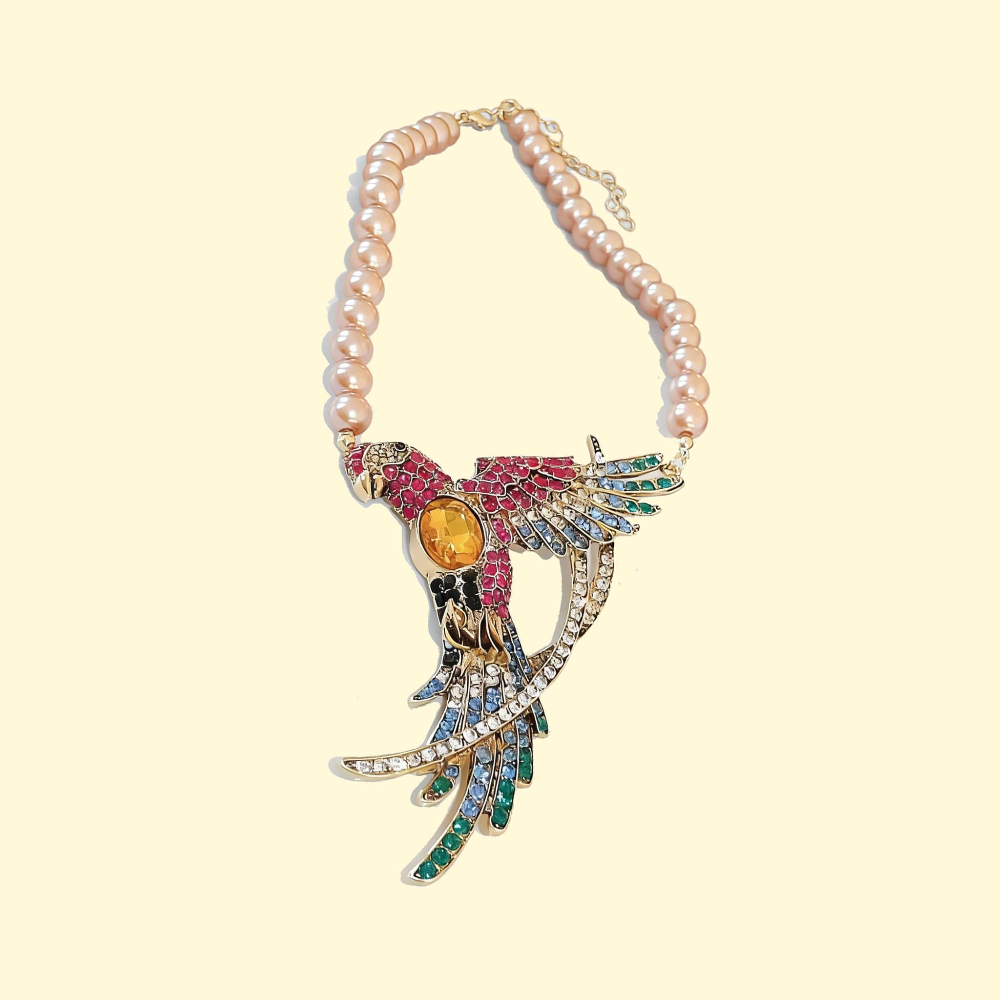 Joy Necklace featuring colorful bird design with diamond accent bird jewelry and pearl beads