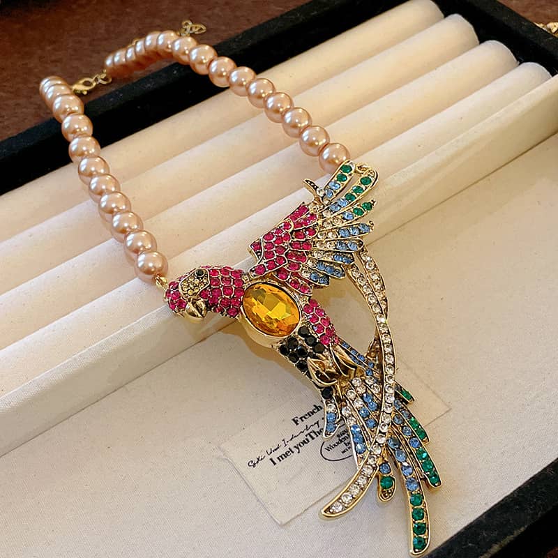 Colorful Joy Necklace featuring a bird design with diamond accent bird jewelry and pearl beads