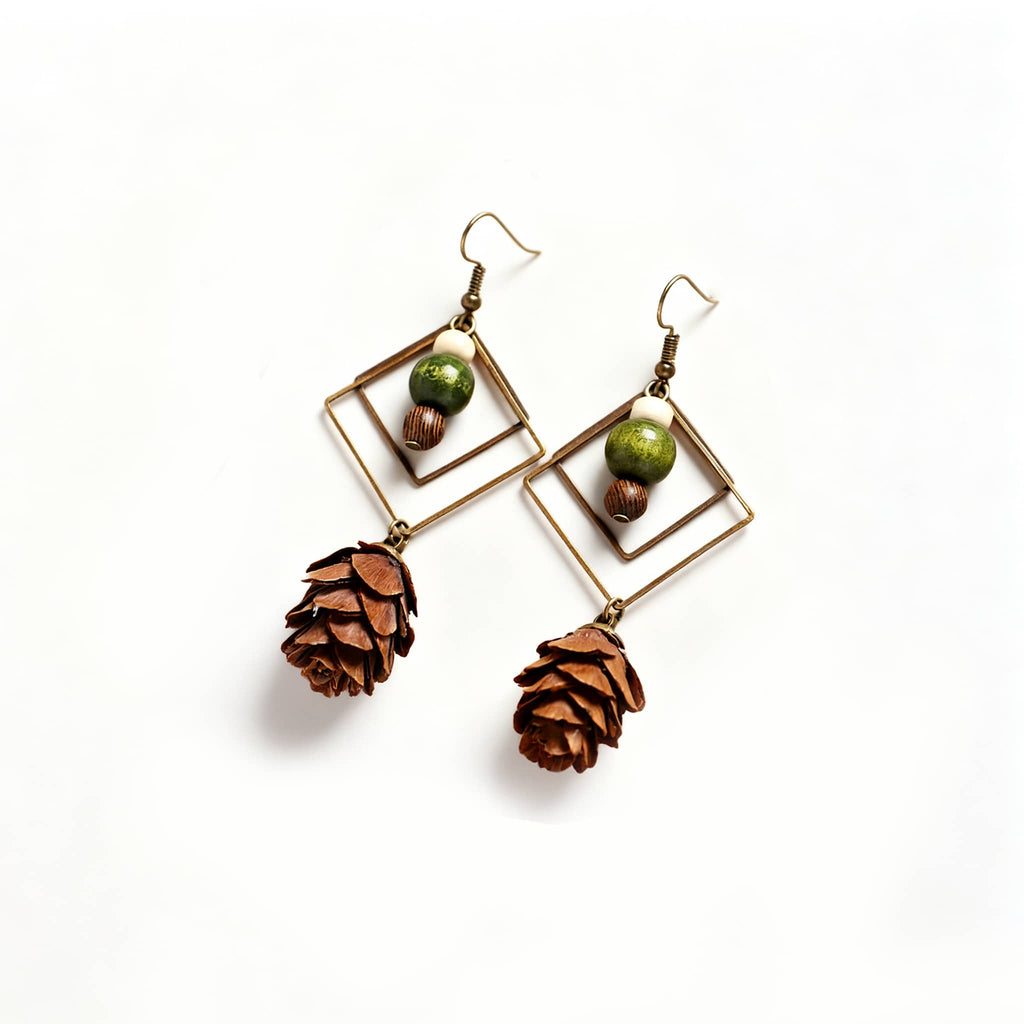 Unique double rhombus statement earrings featuring pinecone and bead accents for a natural look