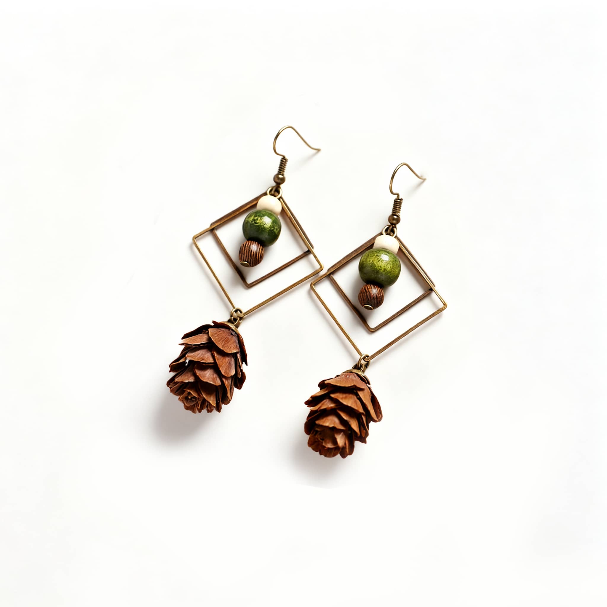 Unique double rhombus statement earrings featuring pinecone and bead accents for a natural look