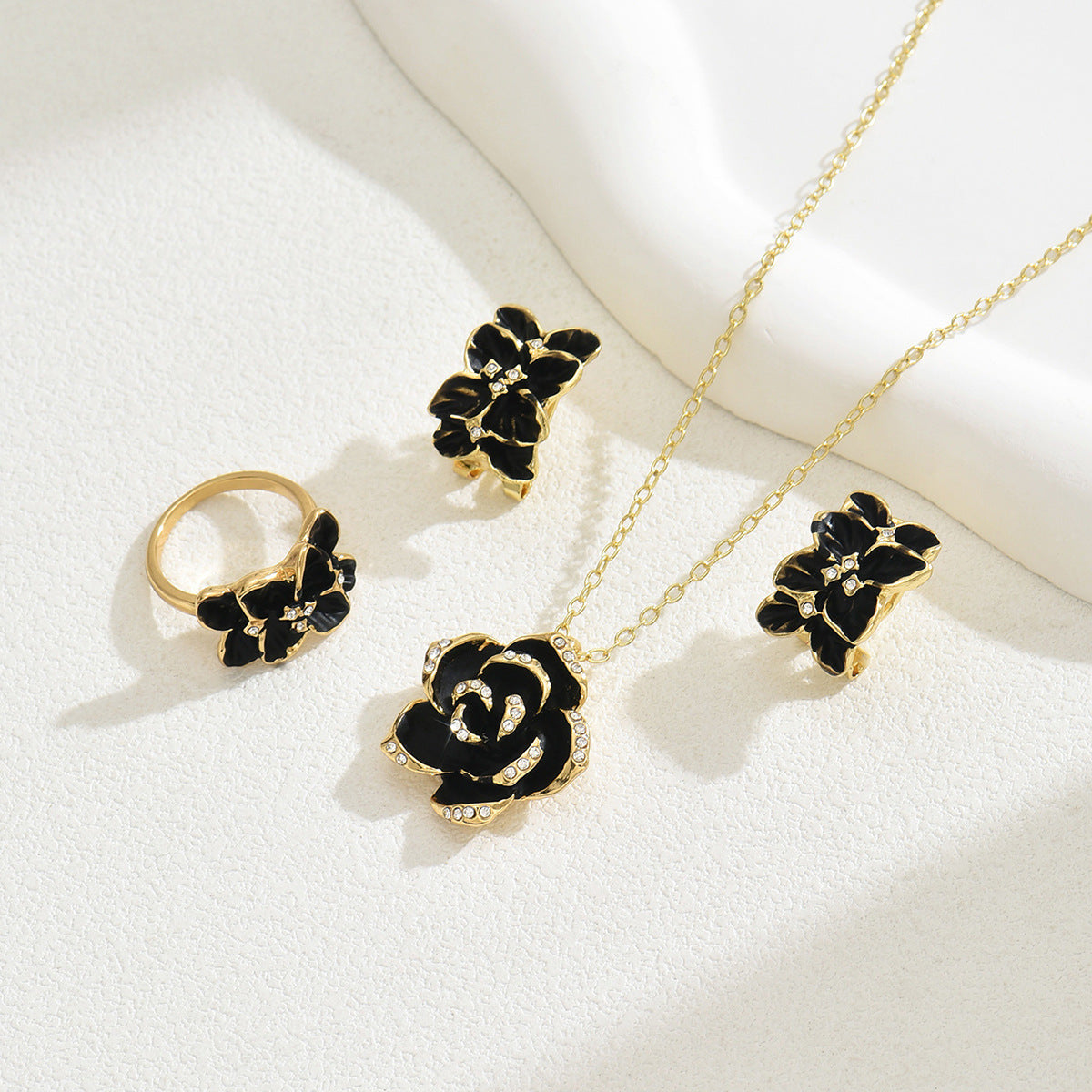 black rose jewelry set gold necklace ring and earrings with black enamel rose pendant and crystal accents