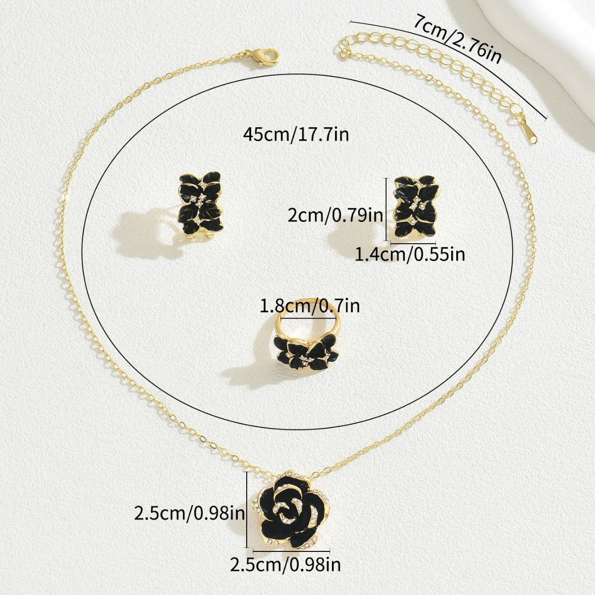 black rose jewelry set gold chain necklace with black enamel rose pendant matching stud earrings and ring on white background