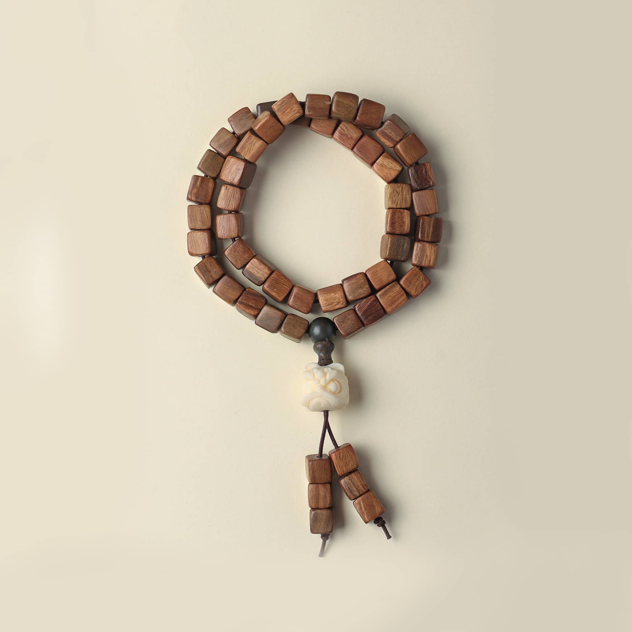 Natural green sandalwood bracelet with wooden beads and decorative accents for relaxation and mindfulness