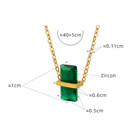 Calm necklace featuring an emerald green pendant necklace with gold chain and zircon accents