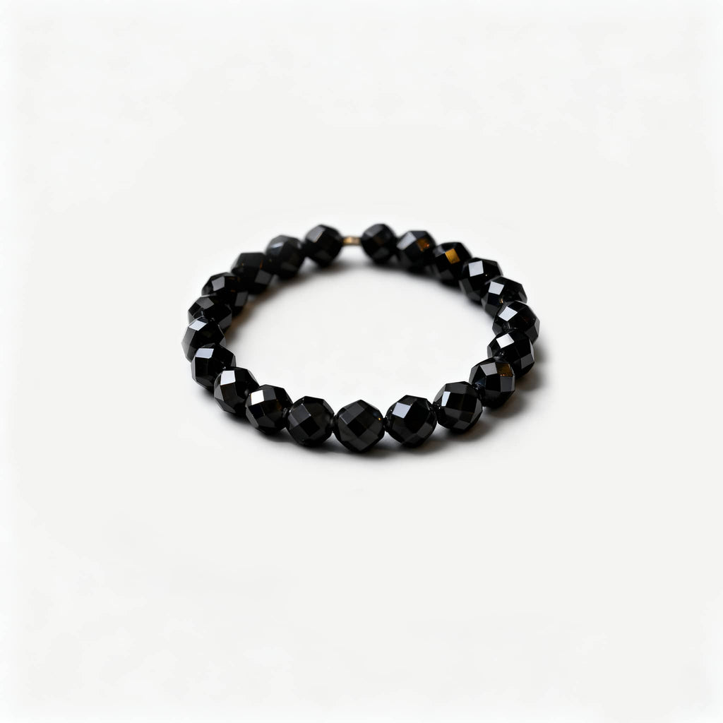 Anxious emotional support gemstone ring featuring faceted black beads for calming energy