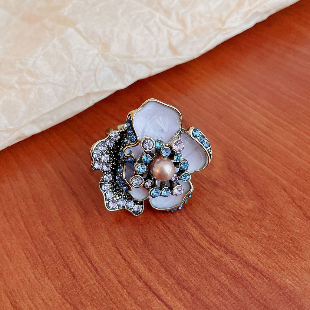 5 Senses enamel flower ring with pearl center featuring colorful accents and intricate design