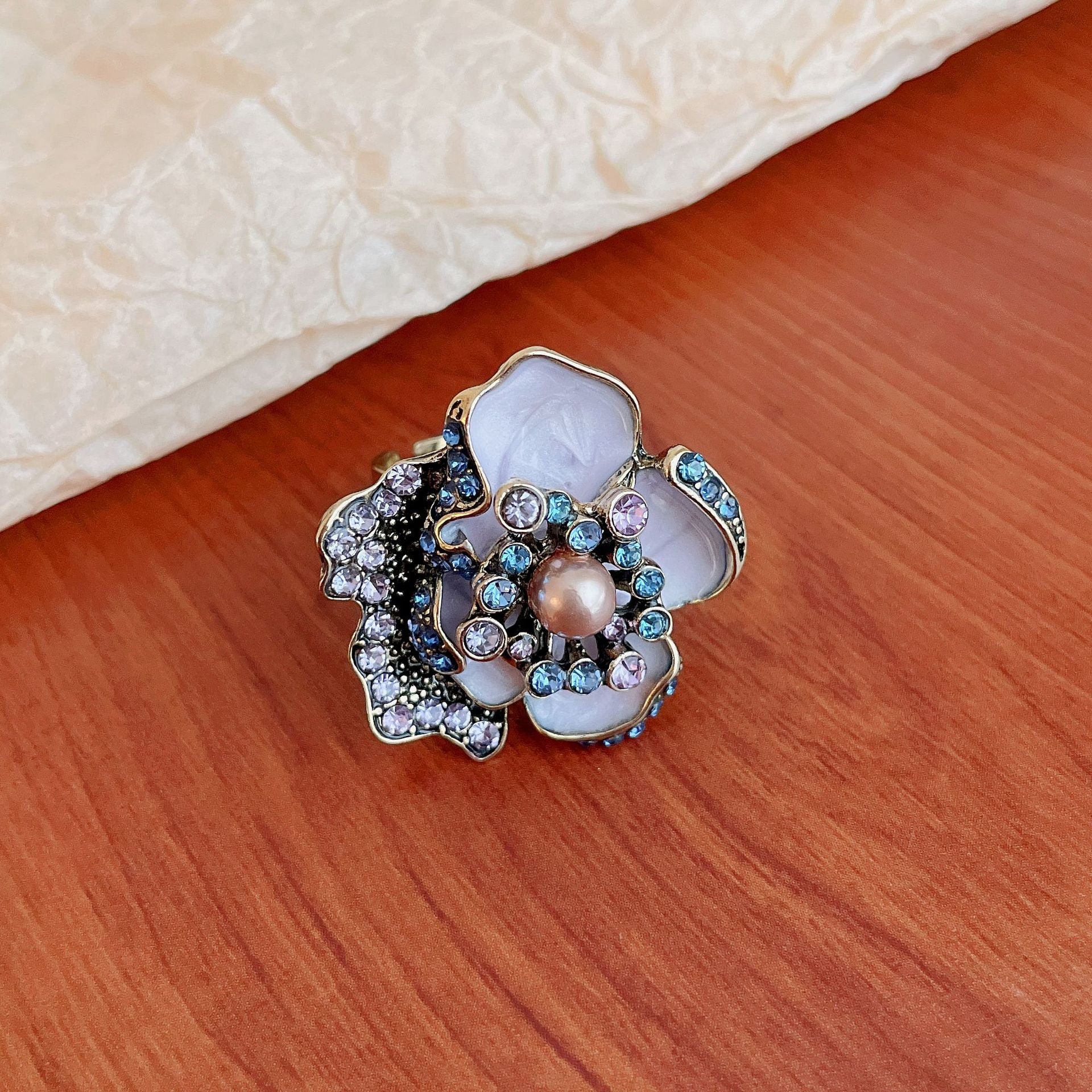 5 Senses enamel flower ring with pearl center featuring colorful accents and intricate design