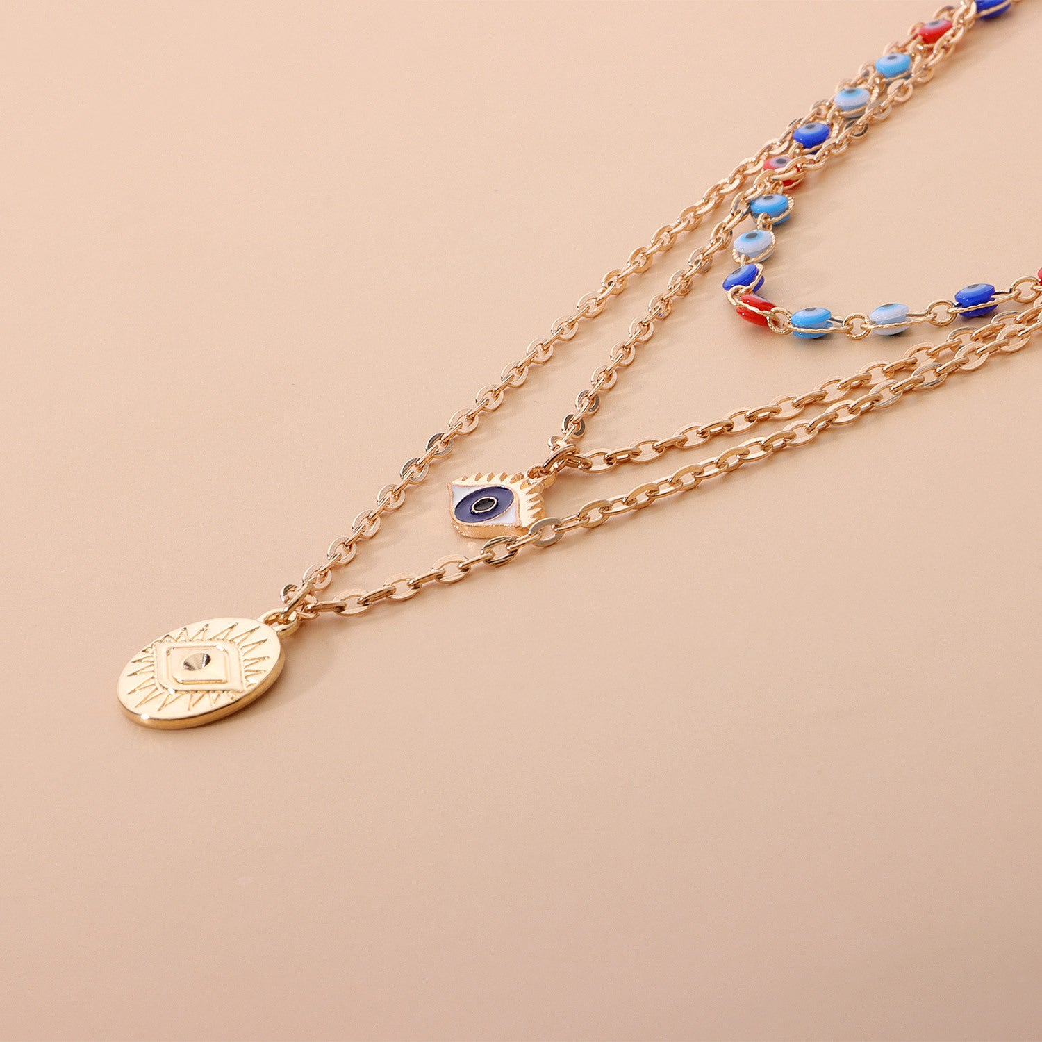 Gold layered evil eye necklace for anxiety with colorful beads and protective charm pendants
