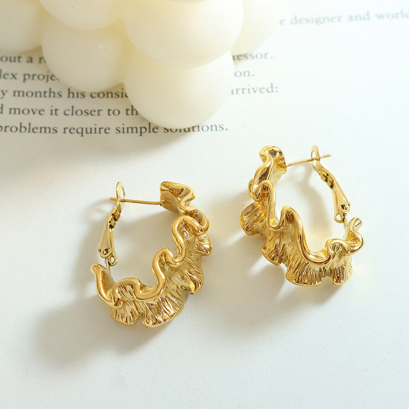 Fierce gold pleated earrings for women designed with a unique wavy texture and polished finish