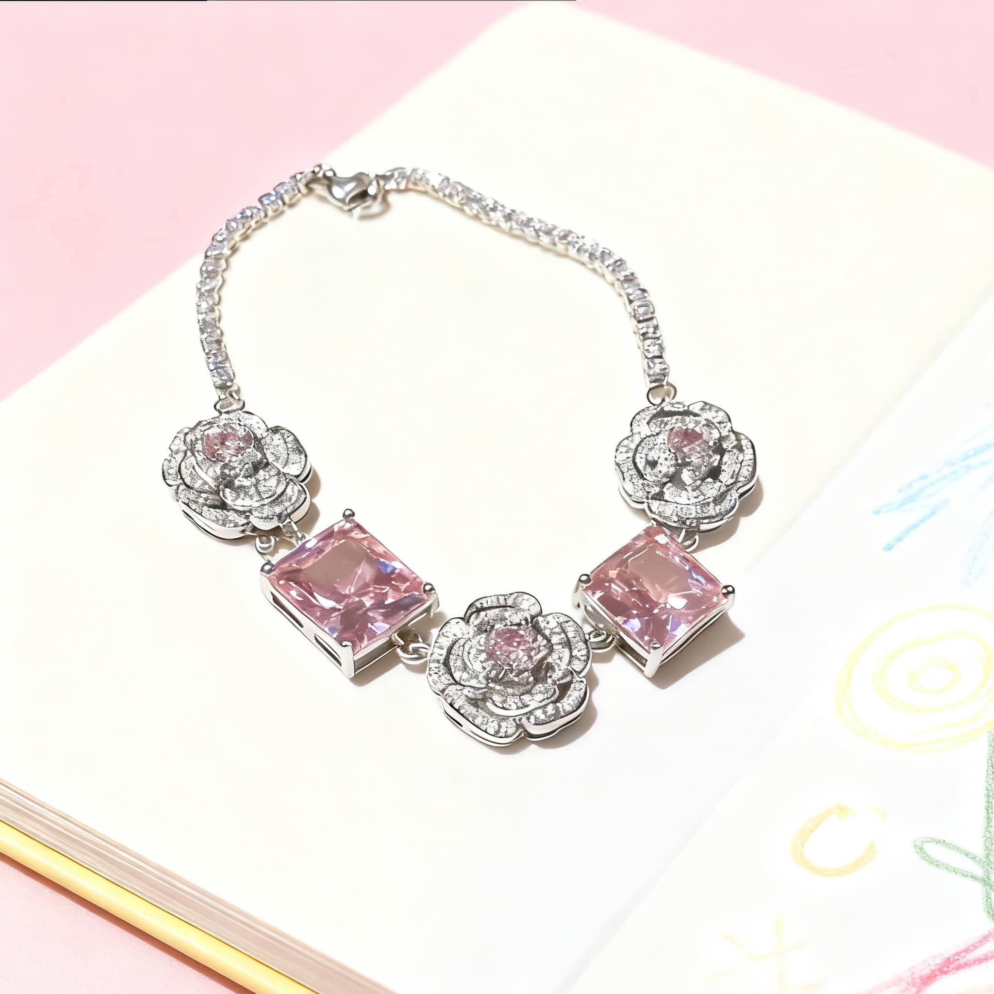Elegant floral chain bracelet for women featuring pink gemstones and intricate flower designs