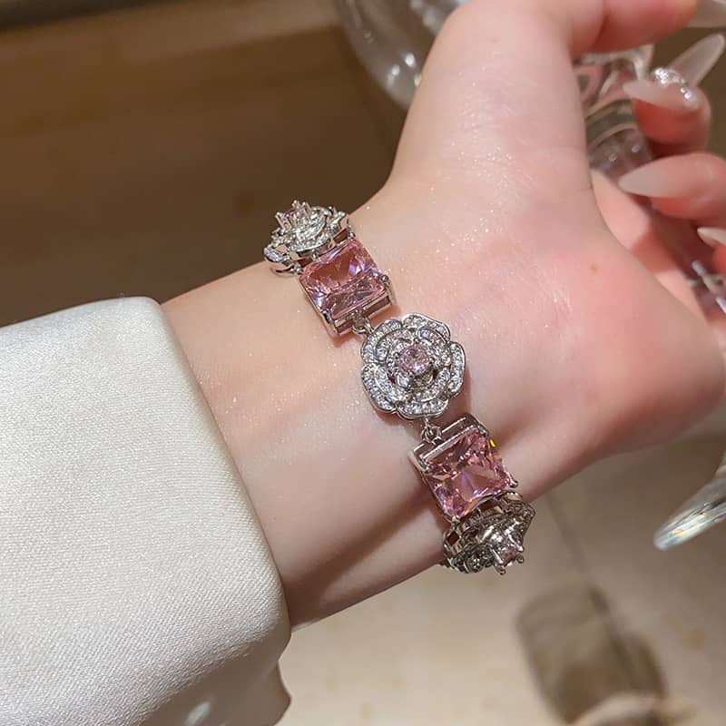 Joy floral chain bracelet for women featuring sparkling pink gems and elegant floral details