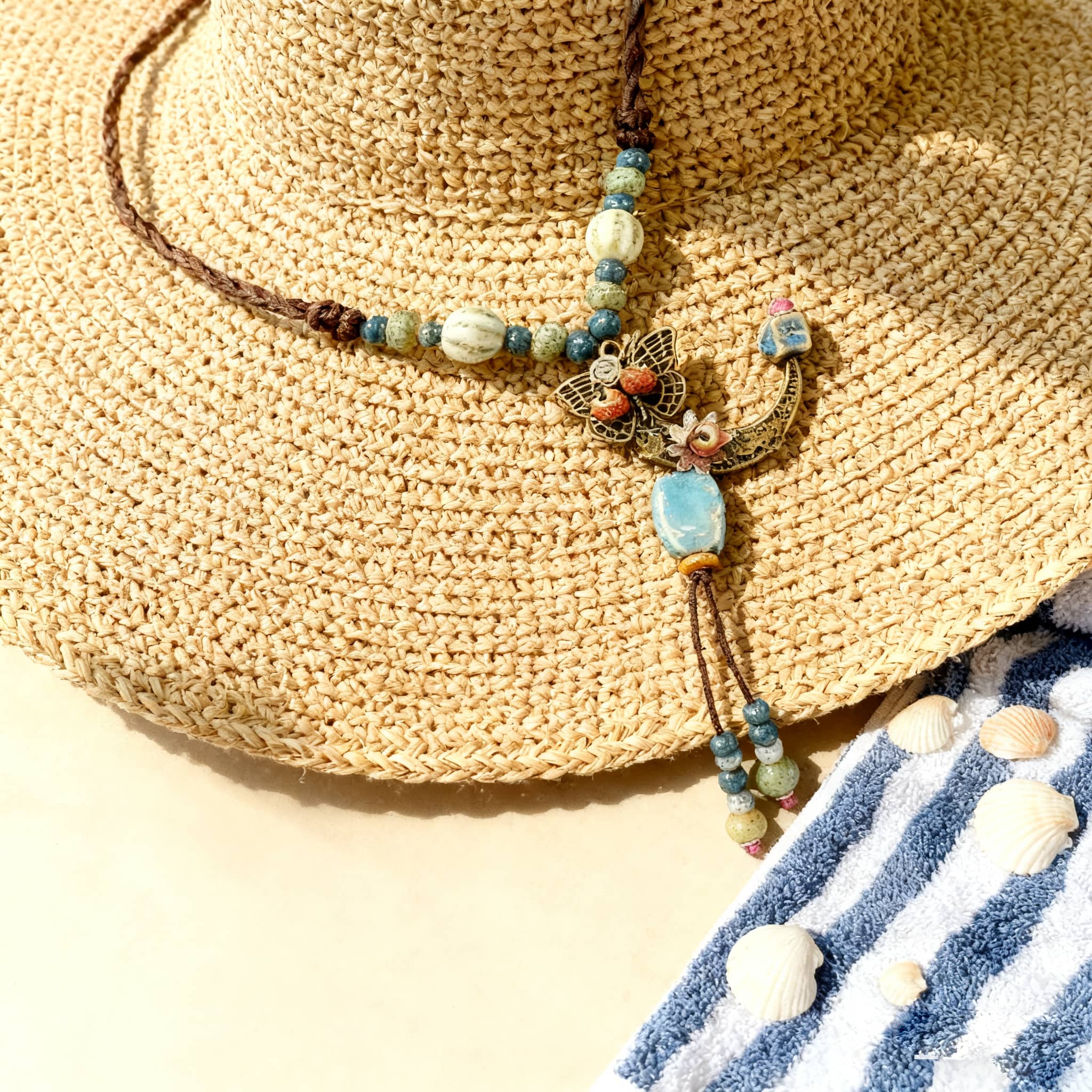 Floral moon pendant necklace from 5 Senses featuring a bohemian design with beads and butterfly details