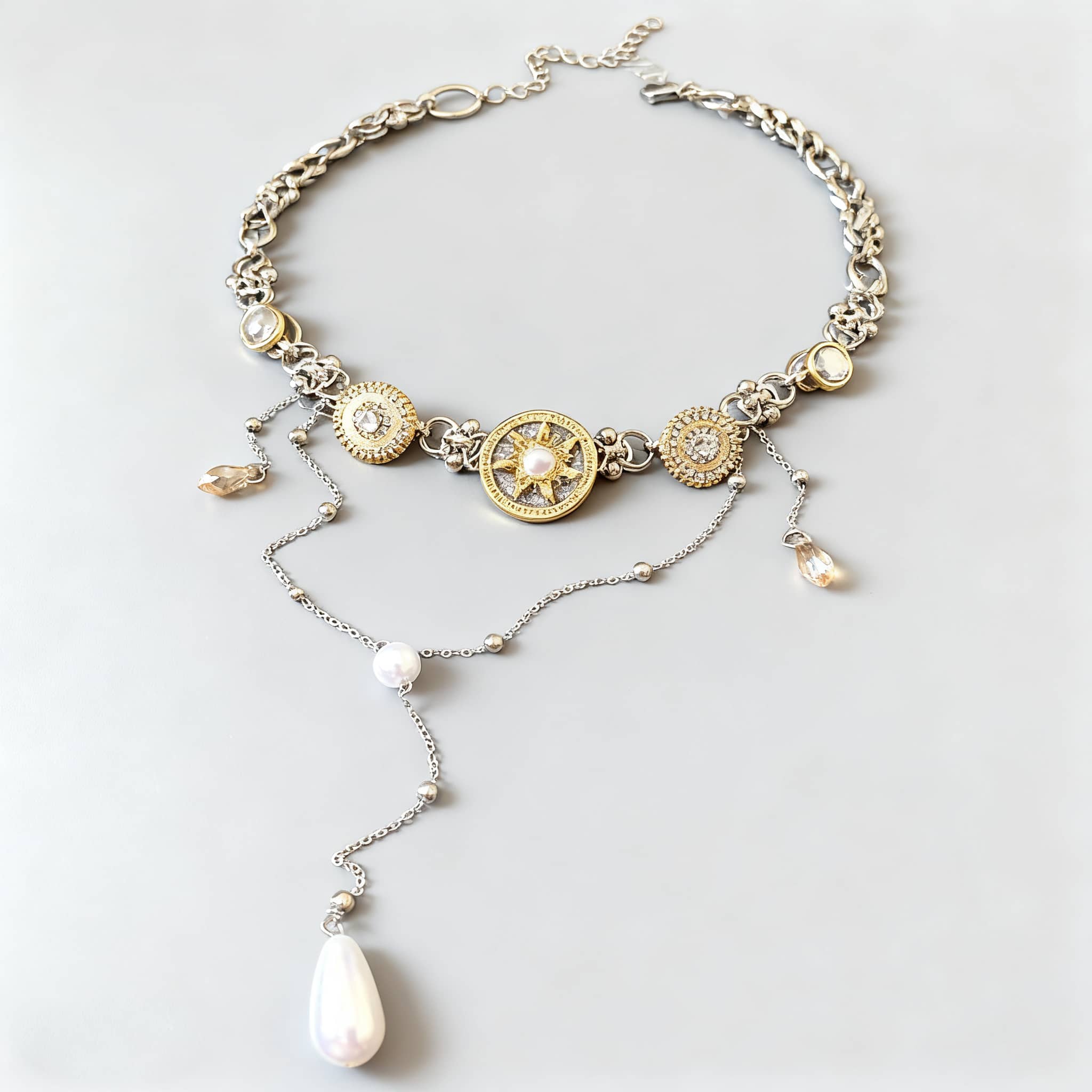 Elegant floral pearl pendant necklace with gold and silver accents for a stylish look