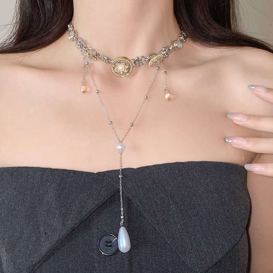 Elegant floral pearl pendant necklace featuring intricate floral designs and a stunning pearl drop