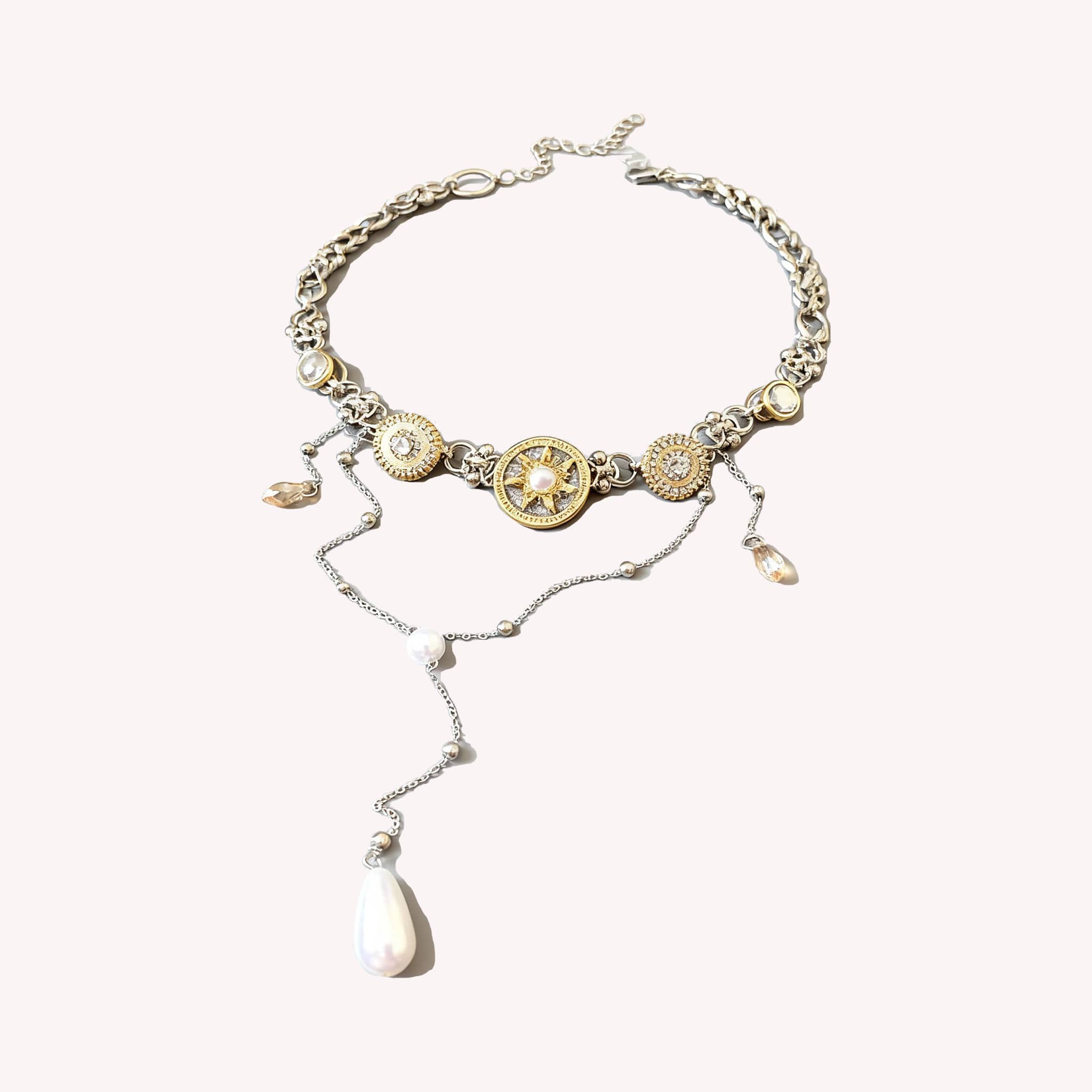 Floral pearl pendant necklace with gold accents and a unique design featuring dangling elements