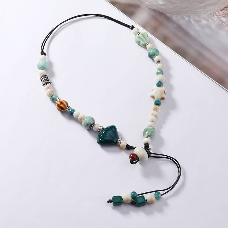 Colorful ceramic scallop necklace featuring various beads and a unique design for a stylish accessory