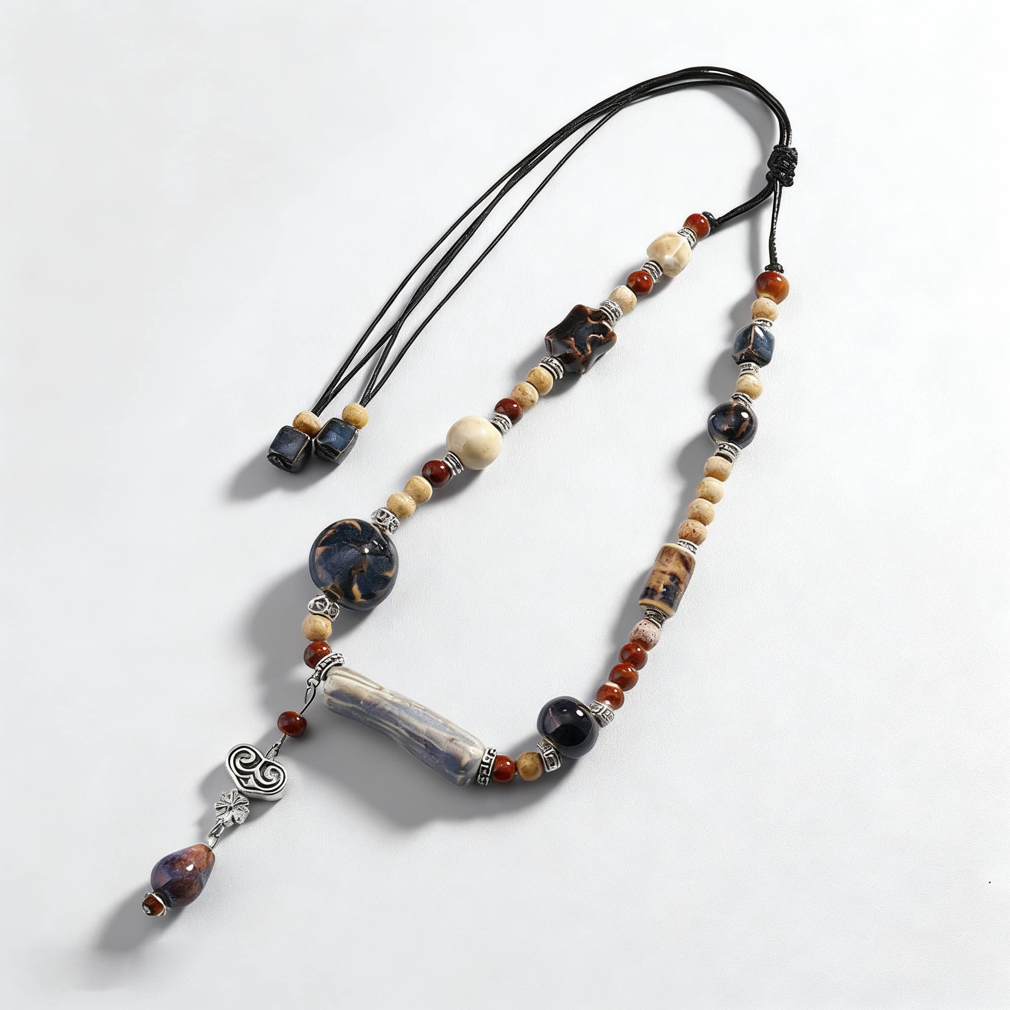 Unique Insecure Necklace featuring a lavender grey ceramic pendant with assorted beads and an adjustable cord