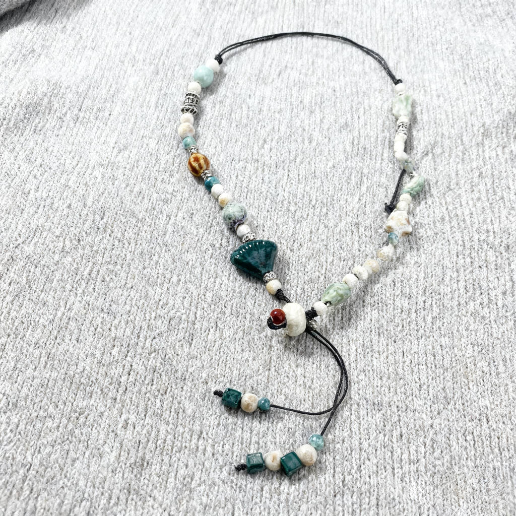 Unique ceramic scallop necklace with assorted beads and adjustable design for a stylish look