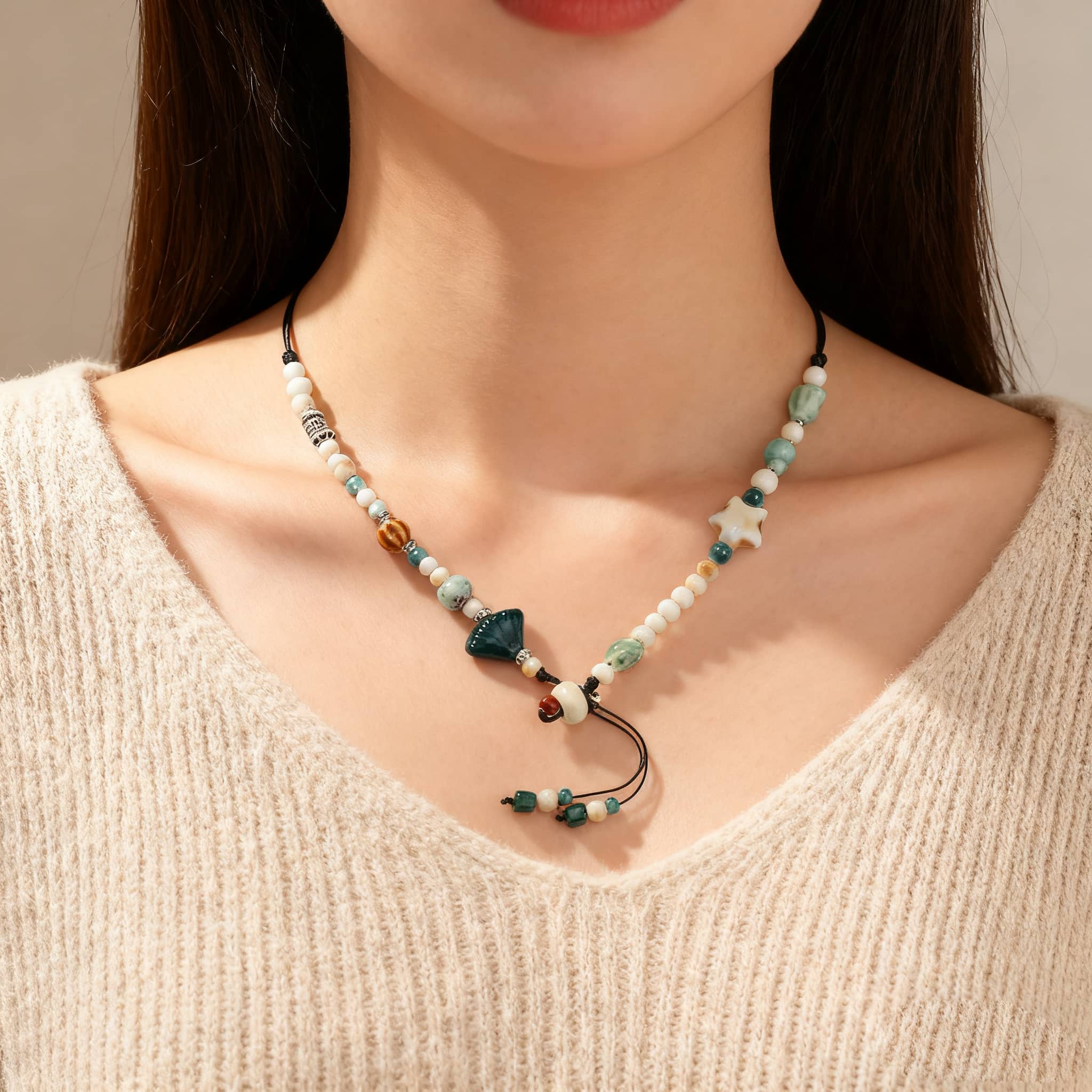 Ceramic scallop necklace featuring colorful beads and unique shapes for a trendy look