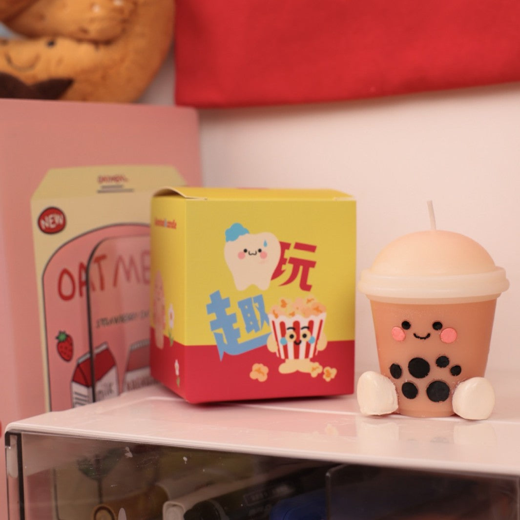 Hyper realistic food candle shaped like a cute bubble tea drink with smiley face and tapioca pearls