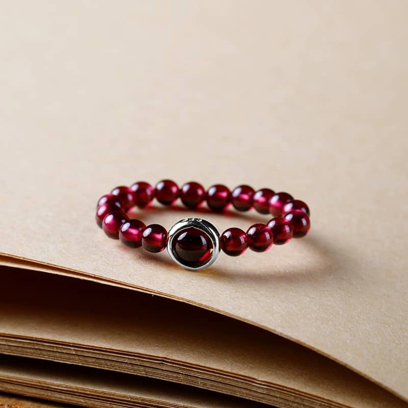 Garnet anxiety ring with smooth red beads designed for calm and comfort during stressful moments
