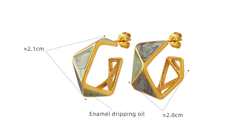 Calm geometric enamel earrings in gold with green and gray enamel detailing and angular design