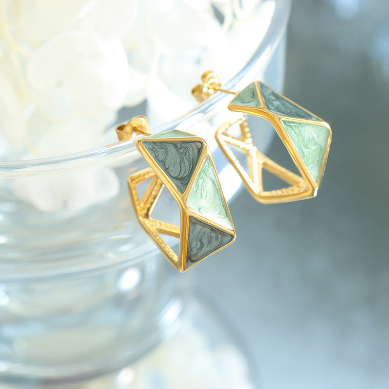 Calm geometric enamel earrings with gold frame and green patterned enamel design