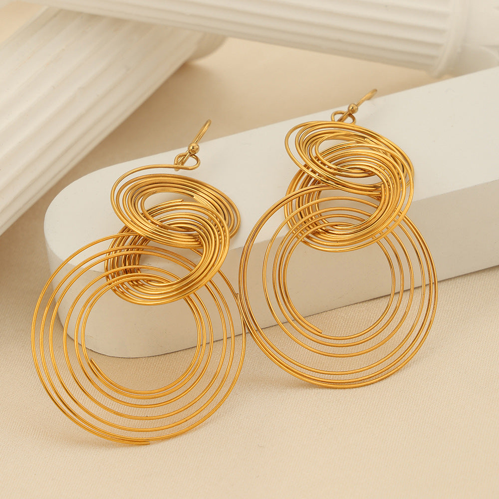 Gold tone circular anxious earrings designed as anxiety calming jewelry for stylish comfort
